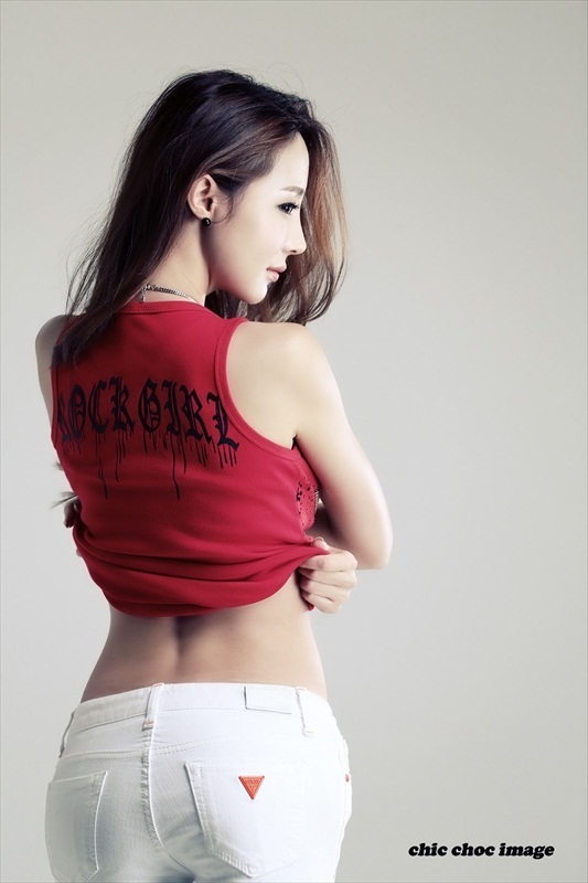 Asian girl takes off top